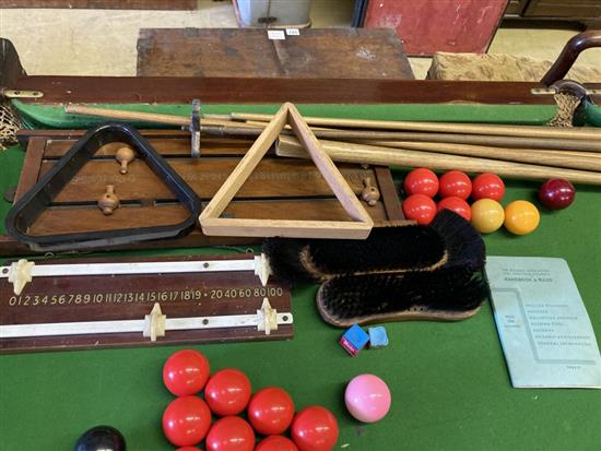An early 20th century mahogany slate bed snooker table and accessories, width 194cm, depth 102cm